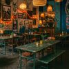 Super-Seat | Een gezellig café met rustieke groene vintage veldtafels, olijfkleurige leger klaptafels & houten stoelen Groene metalen tafels, olijfkleurige klaptafels, houten stoelen, muurschilderingen, zitbanken. | Horecameubilair