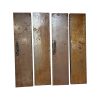 Super-Seat | XL roestige corten stalen deuren met klinknagels, zwarte grepen en kettingen op wit. | Horecameubilair